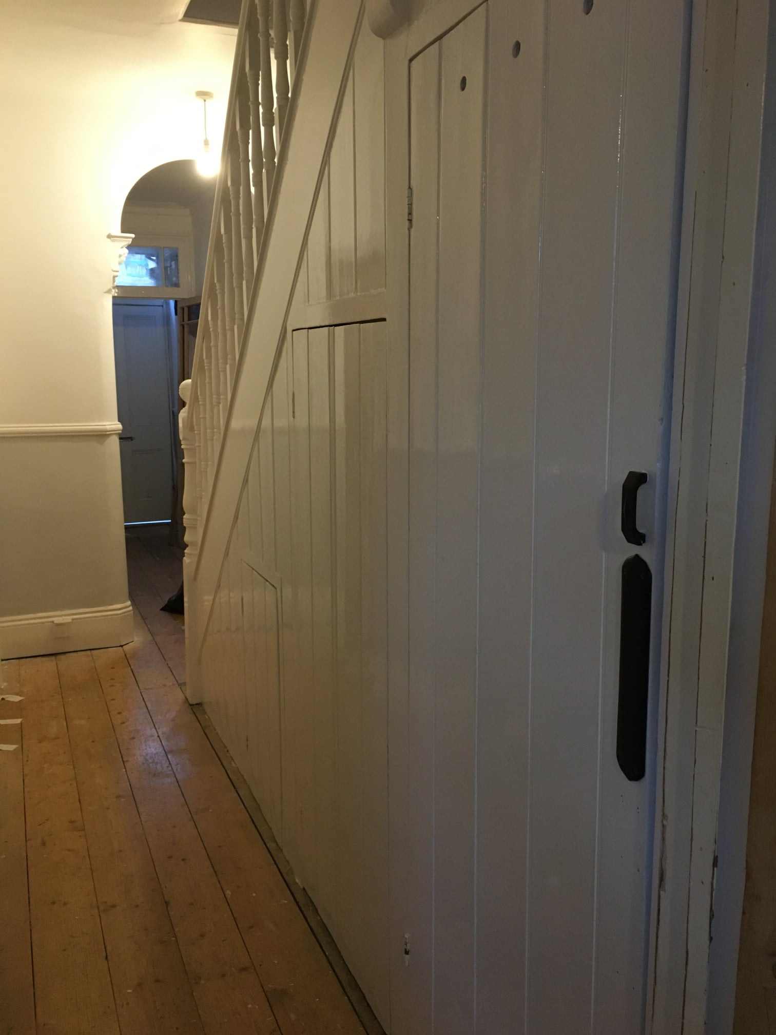 Understair toilet hidden behind the door